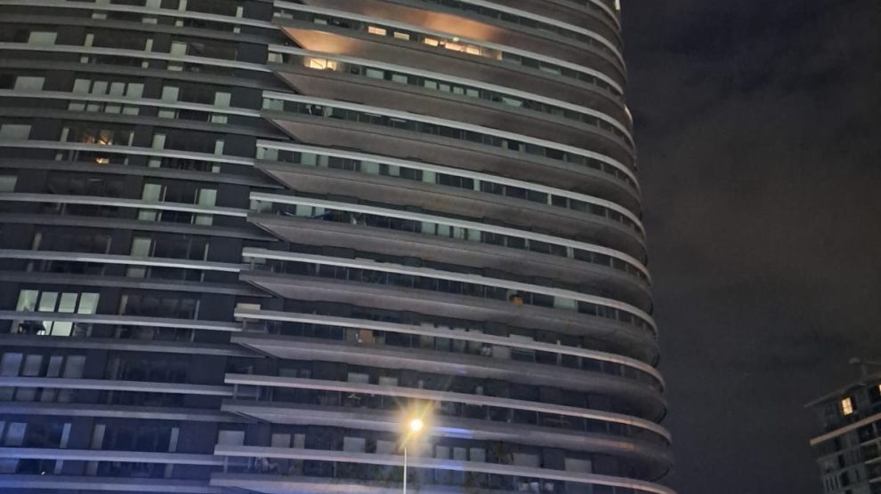 A fire burns on a tower balcoy