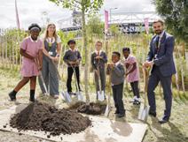 A group of children planting trees