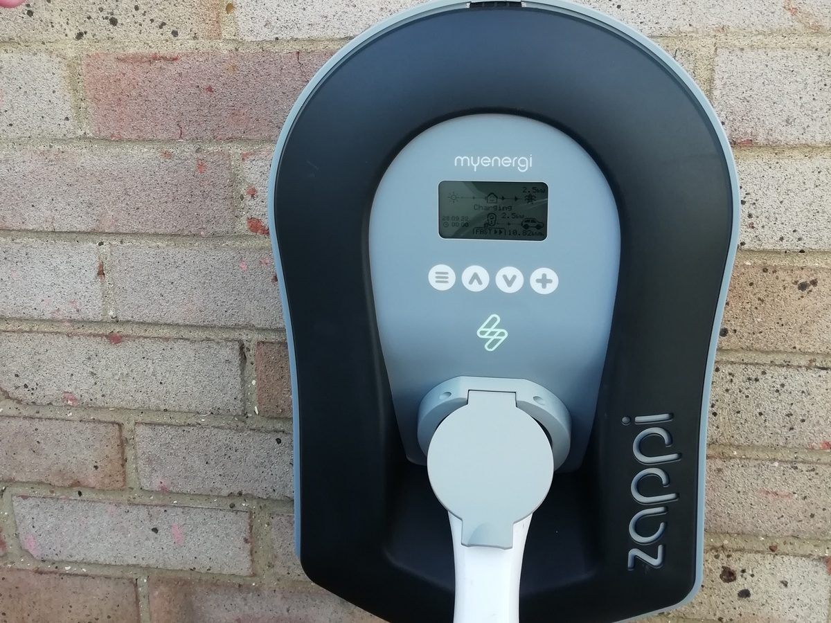 Electric plug on brick wall. 