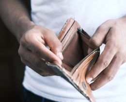 Person opening empty wallet