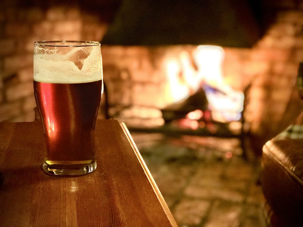 A pint of beer on a welcoming pub table