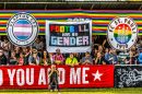Football fans with a banner reading 'football has no gender'