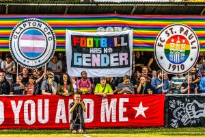 Football fans with a banner reading 'football has no gender'