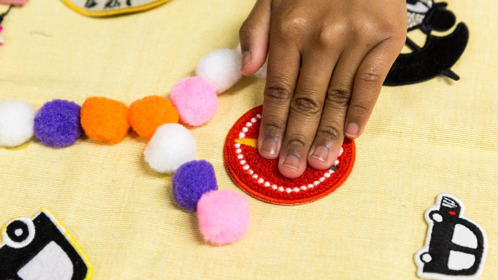 A person does a craft activity