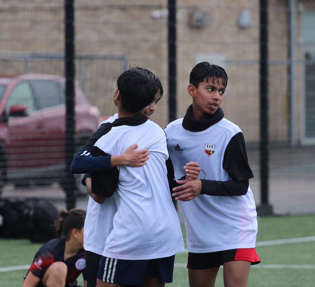 Young people on a football pitch