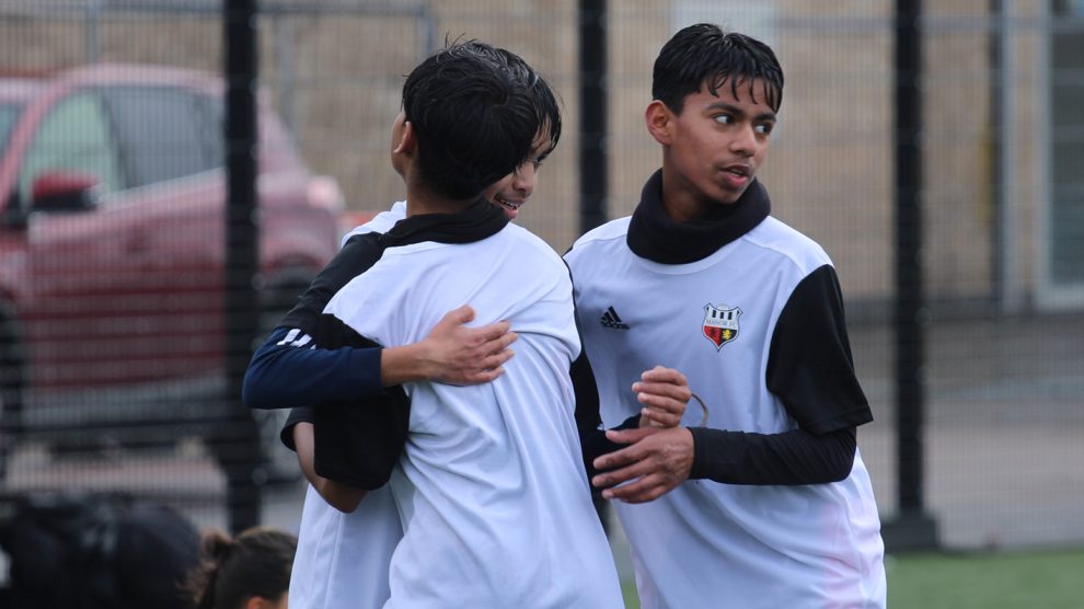 Young people on a football pitch