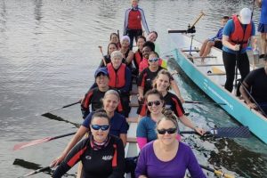 A dragon boat team on the water