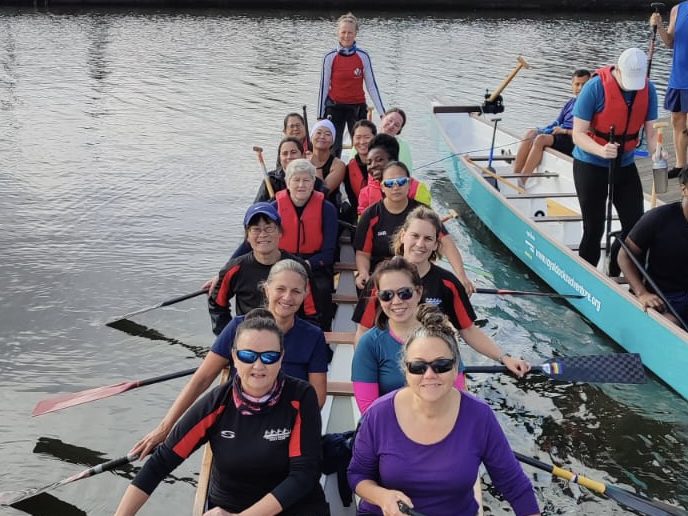 A dragon boat team on the water