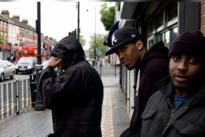 Three young men in a city street