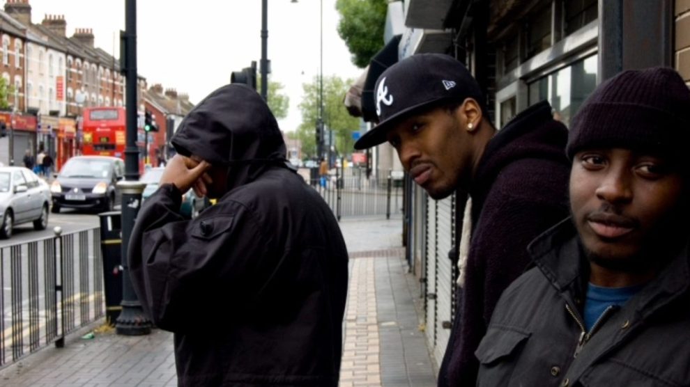 Three young men in a city street