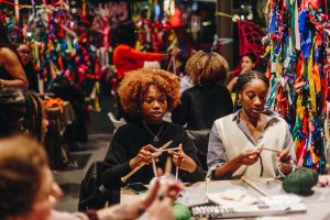 A group of people knit