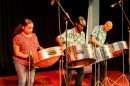 A steel drum band plays