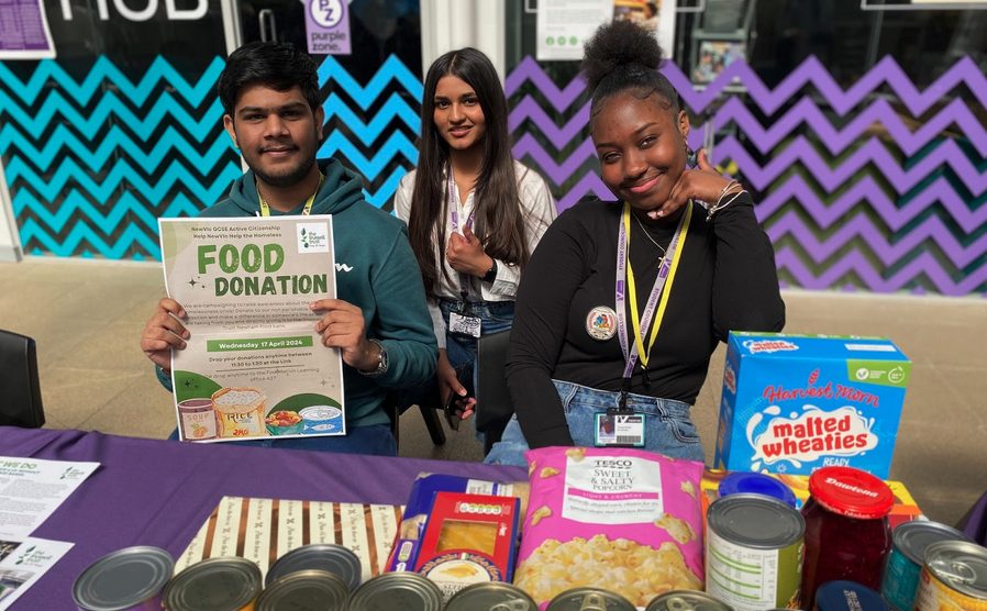NewVIc's student campaigners pose with a donation of foodsftuffs