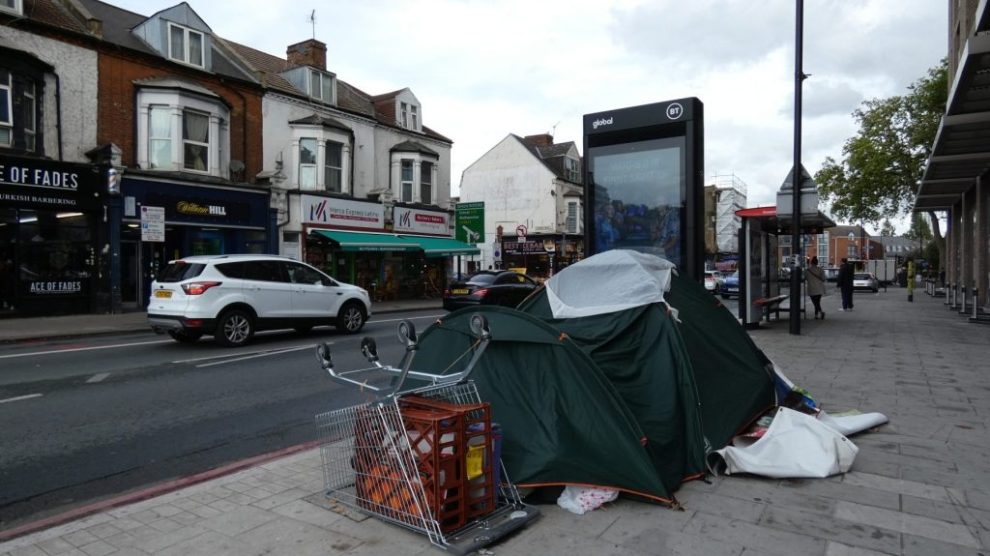 the belongings of someone sleeping rough on a london street