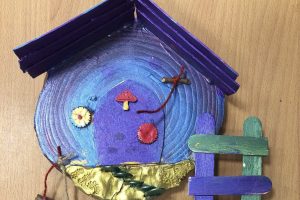 A fairy door made by school pupils to be afixed to a tree