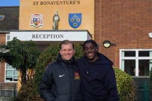 two men stand in front of St Bonaventures