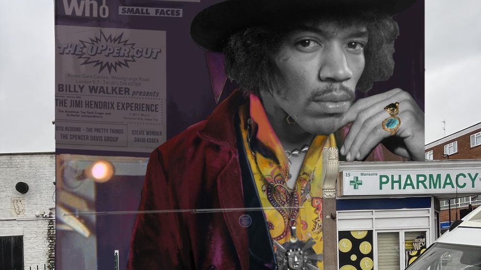A mural of Jimi Hendrix looks down from a wall