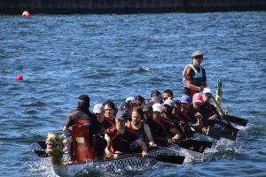 A fully crewed dragonboat on the water