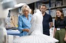 Queen camilla surveys a ballet costume