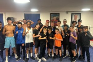 Newham Boys Boxing club and Fairbairn boxing club members flexing