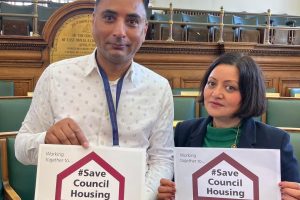 Shaban Mohammed and Mayor Rokshana Fiaz holding signs reading 'Save council housing'