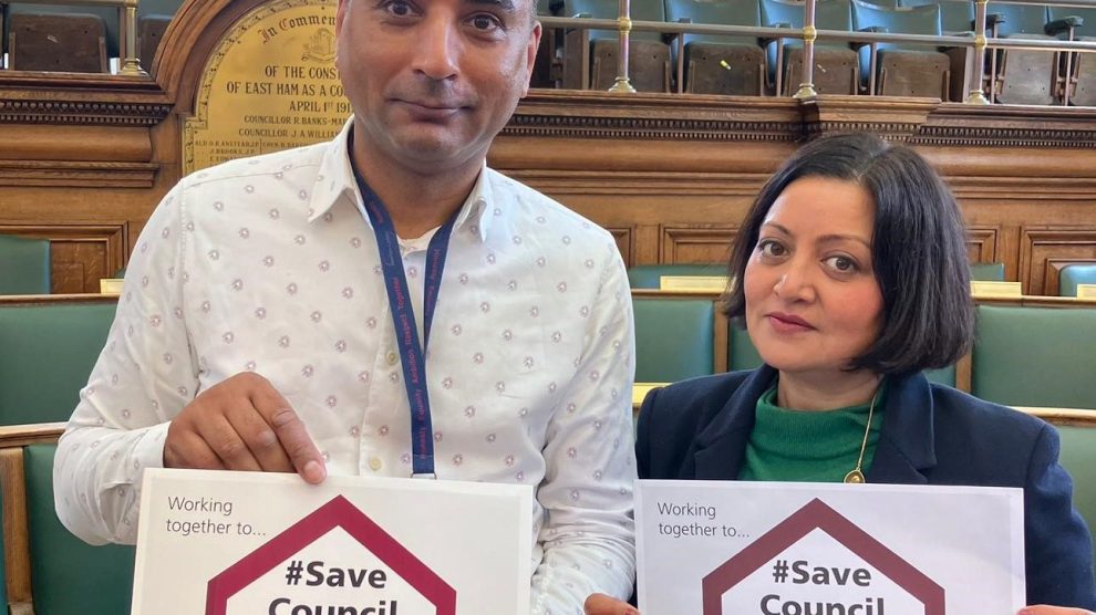 Shaban Mohammed and Mayor Rokshana Fiaz holding signs reading 'Save council housing'