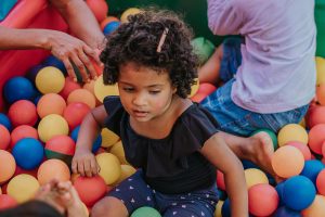 A child plays in a ball pool