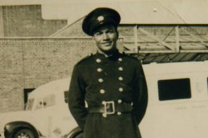 firefighter frank bailey posing for picture, smiling