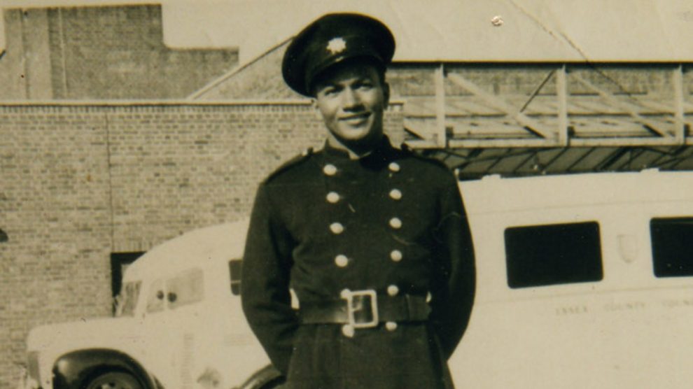 firefighter frank bailey posing for picture, smiling