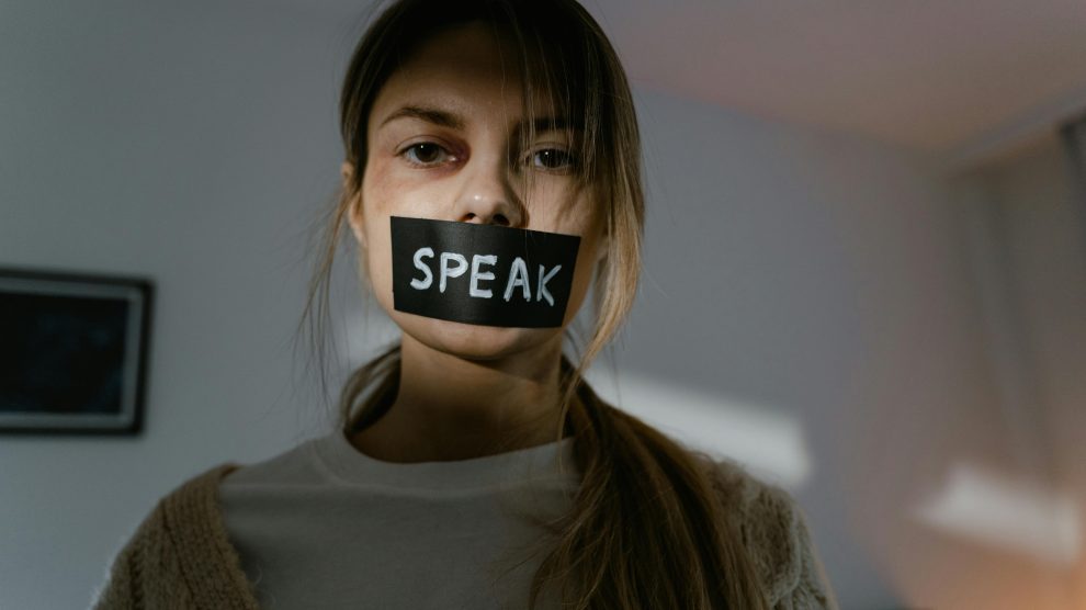 a woman's mouth is tapped