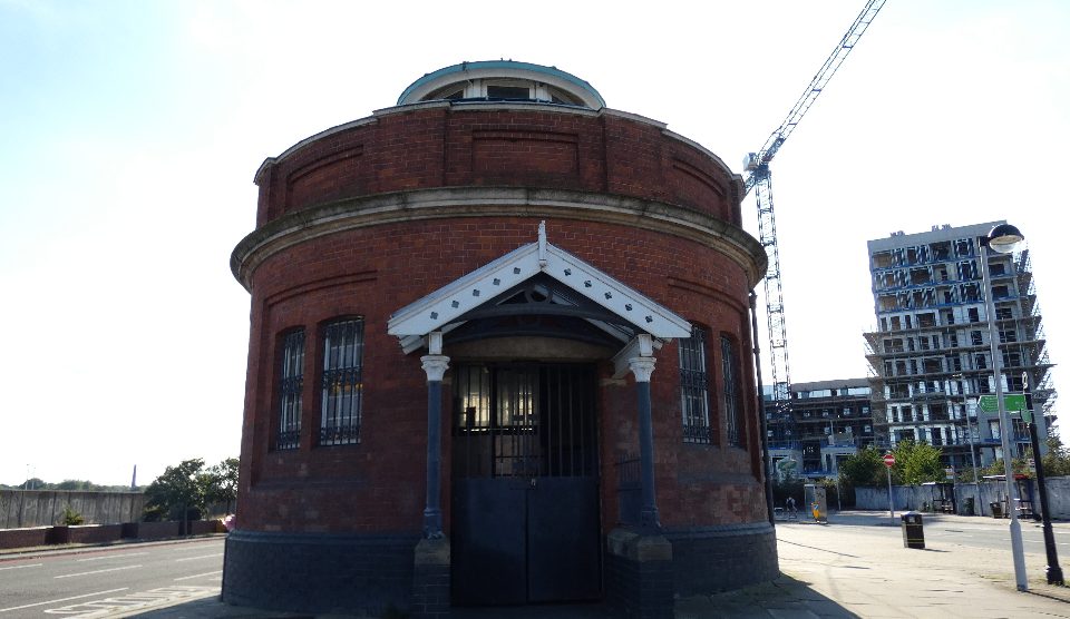 A round red brick block at the northern entrance to the Woolwich foot tunnel