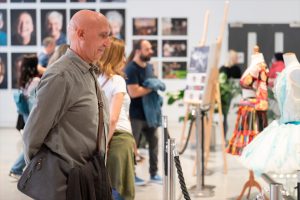 People in a gallery looking at art