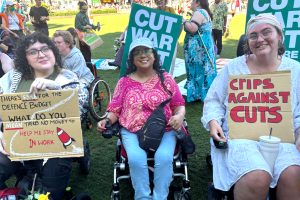 Three campaigners with banners