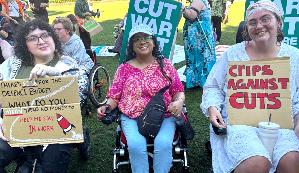 Three campaigners with banners