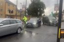 Cars and a cyclist on a road