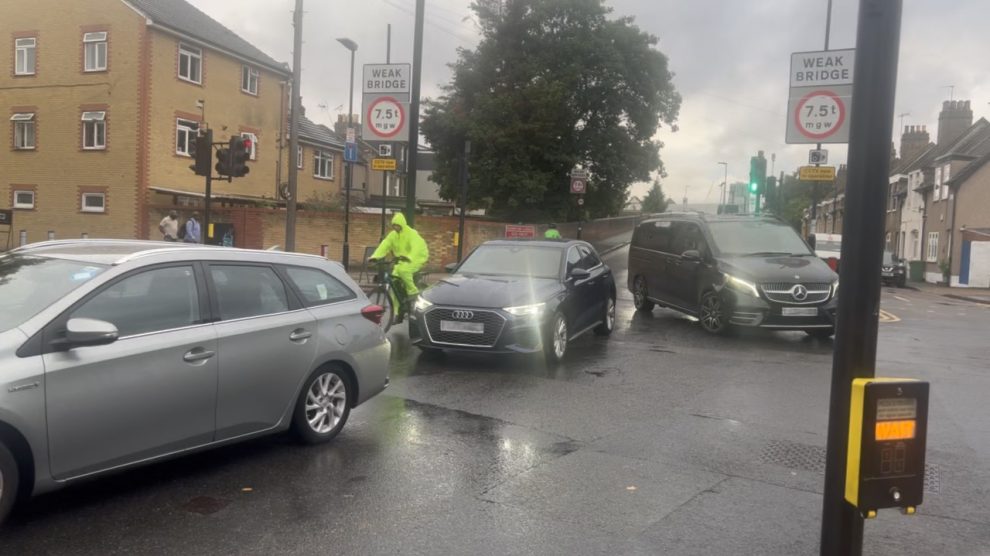 Cars and a cyclist on a road