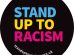A badge saying Stand Up to Racism