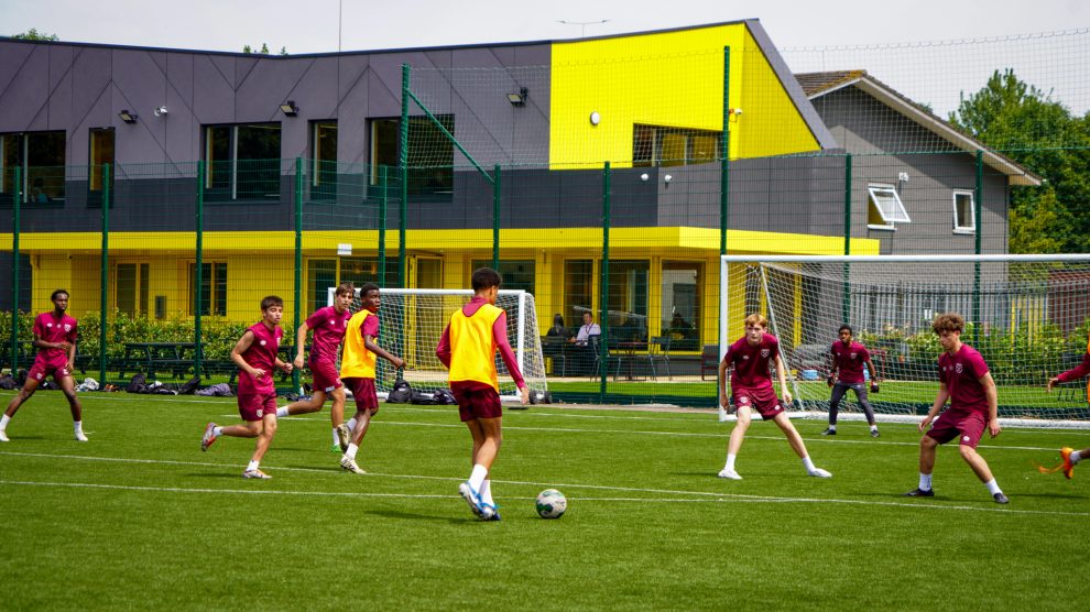 Young people playing football