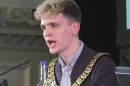 Green councillor Nate Higgins speaks at his first meeting as chair of Newham Council (credit Newham Council)