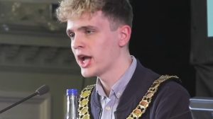Green councillor Nate Higgins speaks at his first meeting as chair of Newham Council (credit Newham Council)