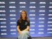 Katie Zelem in front of a promotional backdrop