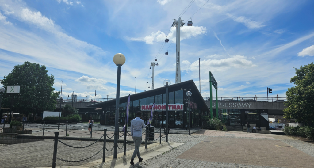 A restaurant with a paved walkway in the foreground