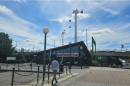 A restaurant with a paved walkway in the foreground
