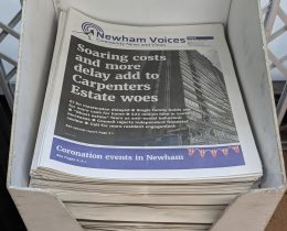 Printed Newham Voices newspapers in a display stand