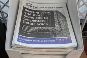 Printed Newham Voices newspapers in a display stand
