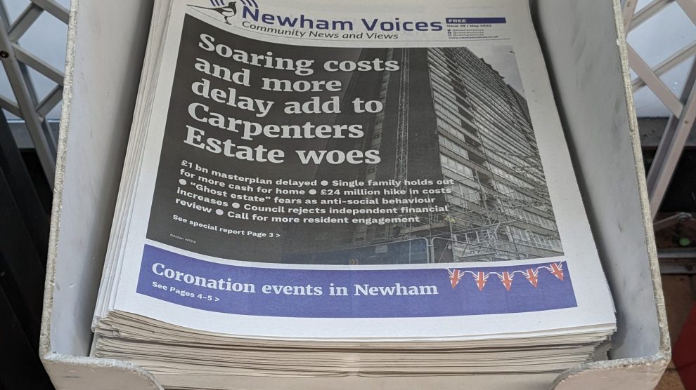 Printed Newham Voices newspapers in a display stand