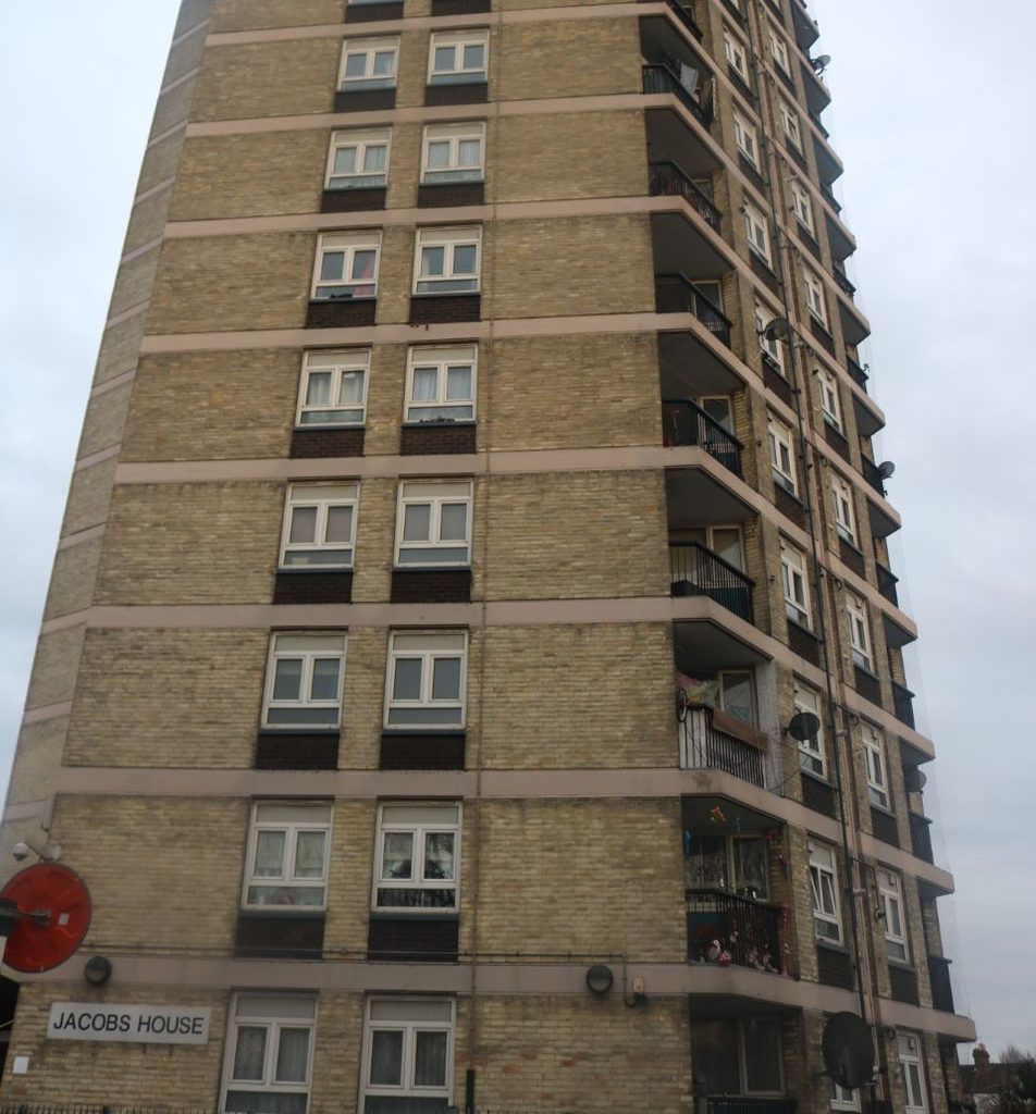A tower block pictured from the ground upwards